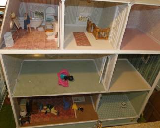 The Colonial home, did not sustain any damage due to the earthquake in Doll Houseville.  Sorry little dude, didn't mean to interrupt bath time 