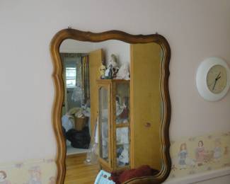 Another large mirror, framed in wood
