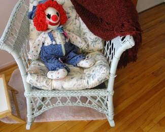 That's Chuck. Sitting in a very nice pale green rocking chair made of rattan