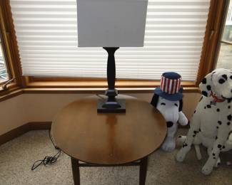 Large round wooden table, with an outstanding stylish lamp