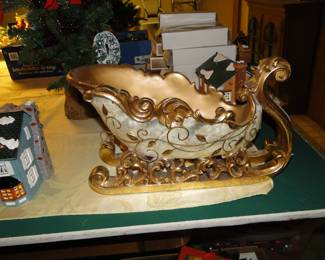 Large golden sleigh for displaying your vintage Christmas decorations