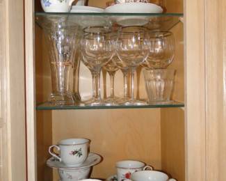 Gold rimmed wine glasses, and more teacups and saucers