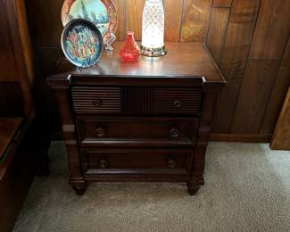 There is two matching bedside tables