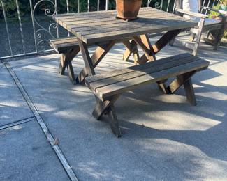 Teak picnic table 48"wide x 23"d x 30"h. For sale during in person sale hours Friday and Saturday.