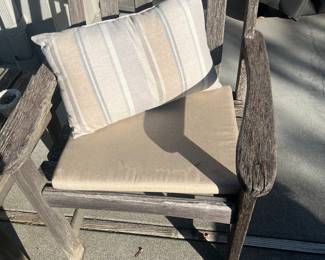 One of the pair of teak chairs. For sale during in person sale hours Friday and Saturday.