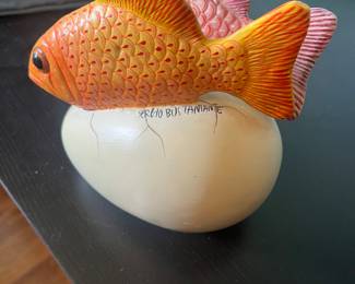 Sergio Bustamante signed ceramic egg with two fish. Available for in person purchase on Friday and Saturday.