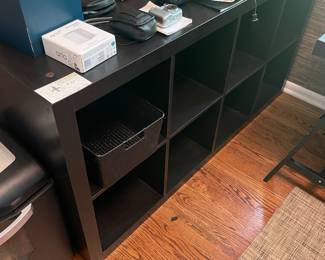 $90 One of two 8-cubicle storage/book case. Available for online purchase. 58.75”w X 15.5”d X 31’h.