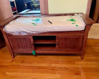 Nice oak bench with cushion.