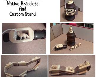 Very unusual carved wood stand with two beautiful bracelets. One bracelet has a dog sled with dogs going around.