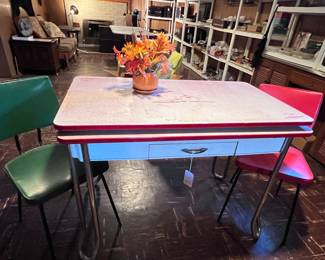 Very nice vintage porcelain top table and two chairs.