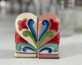 Retail: $28. Our Price: $12. With intricate designs, these decorative shakers serve as both functional and artistic table pieces.