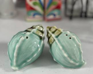 Retail: $25. Our Price: $10. These elegant ceramic shell shakers add a coastal charm to your dining table.