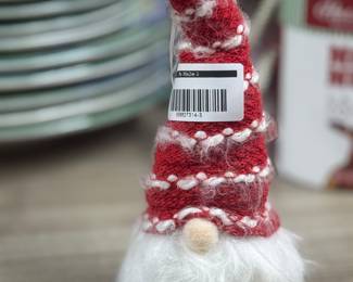 Retail $7.99. Our Price: $3.00. Charming red gnome with a fluffy beard, perfect for festive home decor or as a holiday gift.