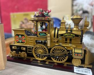 Retail $65. Our Price: $28. Christmas Cannonball Train by Gold Label Collection. Plays 16 Songs and has the original box.