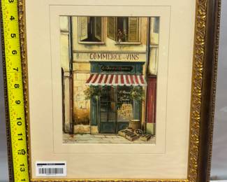 Retail $50. Our Price: $20. Charming framed print of a Parisian cafe scene, measuring 12x15 inches with an ornate gold frame.