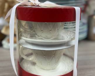 Retail $25. Our Price: $8. Elegant Pearl-Accented Teacup and Saucer Set. Perfect for special occasions or as a charming gift.