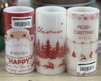Retail $15.00. Our Price: $3.00. Festive candle featuring a cheerful Santa design, perfect for adding holiday spirit to any room.