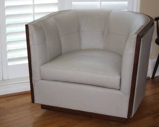 pair of leather swivel chairs by Kravet