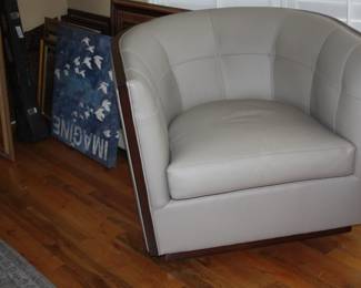 pair of leather swivel chairs by Kravet