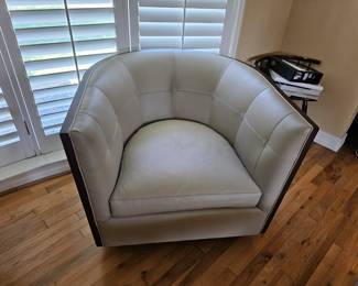 pair of leather swivel chairs by Kravet