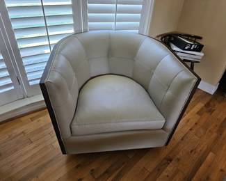 pair of leather swivel chairs by Kravet