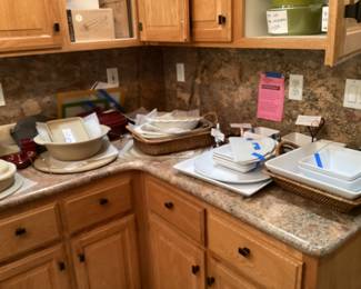 Kitchen counters loaded with BRAND NEW Pampered Chef pieces