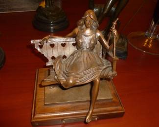 bronze girl on bench