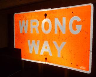 porcelain wrong way sign