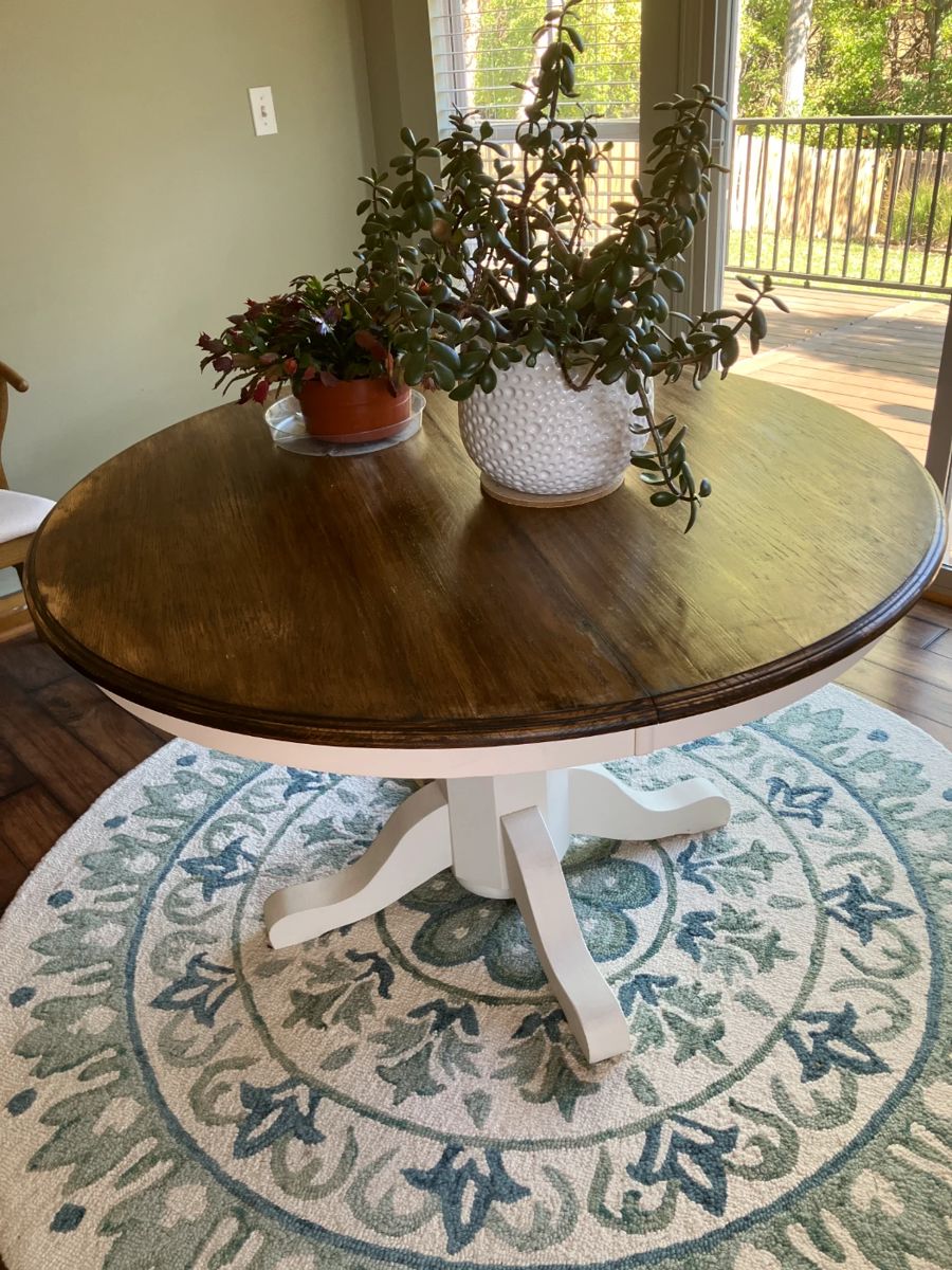 Pedestal table with 48" diameter, Jade plant in white pot, 71" diameter Safaviah rug