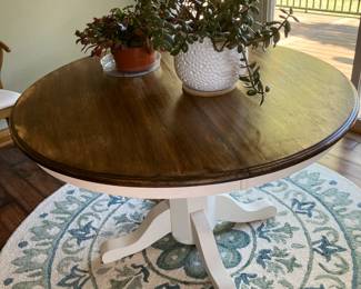 Pedestal table with 48" diameter, Jade plant in white pot, 71" diameter Safaviah rug