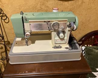 Turquoise and cream Aldens portable sewing machine