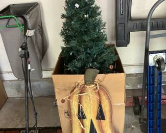 Lighted Christmas tree, jack-o-lantern