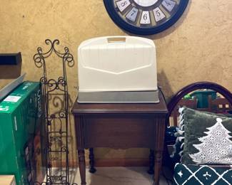 Sewing machine in console, portable sewing machine on top