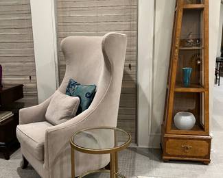 The second contemporary wingback next to a vintage curio accented with birdseye maple
