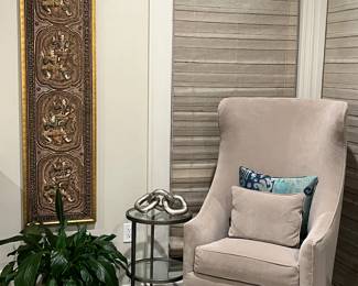 One of two contemporary wingback chairs 