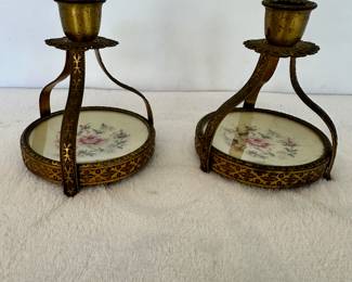 needlepoint and brass candlesticks
