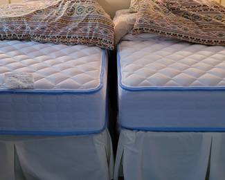 Spring Air twin mattresses and boxsprings on metal frames