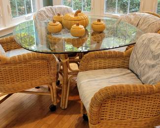 Glass top rattan & wicker dining table and four chairs on casters