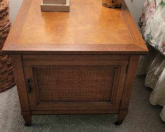 One of a pair of nightstands/small tables with cane front