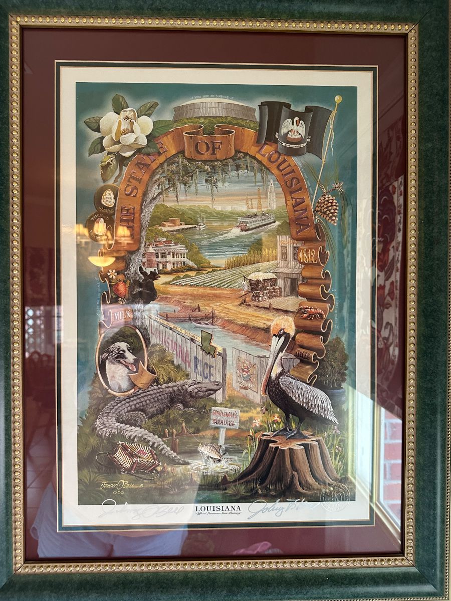“Official Painting For The State Of Louisiana” print, with embossed Seal Of Louisiana bottom right AND original signatures of the artists Johnny O. Bell & Johnny F. Bell (father & son collaboration)…..framed