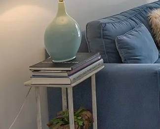 side table, table lamp,  books