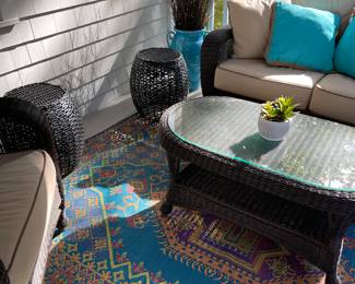 area rug, resin outdoor table, resin sofa, garden stool