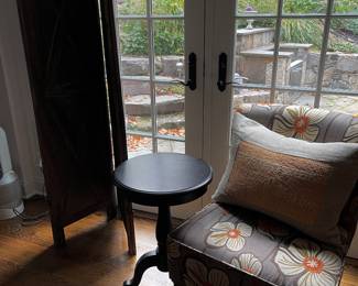 screen, upholstered chair, round table