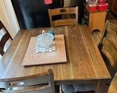 This is a really nice table with 4 chairs and two stools.