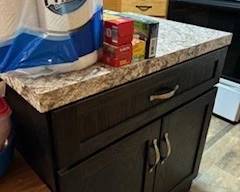 This additional cabinet is on rollers!  Very handy!