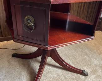 Vintage side table with brass accents