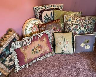 Assorted pillows, many needlepoint