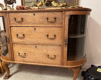 Tiger Oak, cabinet, solid hardwood, paw feet, original hardware, curved panel doors with glass 48 x 17 x 36 inches.
