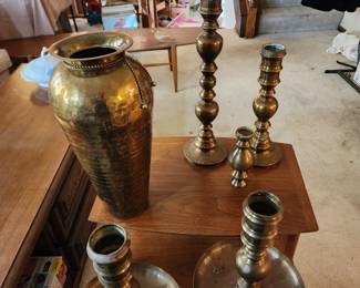 Brass candle holders and a vase