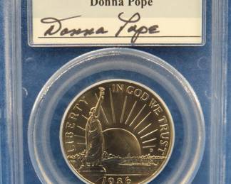 Lot 142. 1986 D A Nation of Immigrants Half Dollar graded MS69 by PCGS